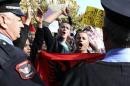 Demonstrators protest against the potential dismantling of Syrian chemical weapons in Albania in front of the Parliament in Tirana