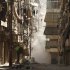 Smoke rises between buildings after shelling by forces loyal to President Assad in Aleppo
