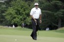 Phil Mickelson reacts to a missed putt on the first hole during the second round of the U.S. Open golf tournament at Merion Golf Club, Friday, June 14, 2013, in Ardmore, Pa. (AP Photo/Darron Cummings)