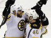 Boston Bruins' David Krejci (46) celebrates his goal with teammate Nathan Horton (18) in the first period of Game 1 of the NHL hockey Stanley Cup Eastern Conference finals against the Pittsburgh Penguins, Saturday, June 1, 2013, in Pittsburgh. (AP Photo/Gene J. Puskar)