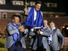 Team Europe captain Olazabal is lifted up by Westwood and McDowell after the closing ceremony of the 39th Ryder Cup at the Medinah Country Club