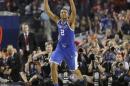 Kentucky guard Aaron Harrison (2) celebrates after making a three-point basket in the final seconds against Wisconsin to win the game 74-73 during their NCAA Final Four tournament college basketball semifinal game Saturday, April 5, 2014, in Arlington, Texas. (AP Photo/Charlie Neibergall)