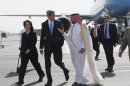 U.S. Ambassador to Qatar Susan Ziadeh, left, walks with U.S. Secretary of State John Kerry, second from left, and Ambassador Ibrahim Fakhroo, Qatari Chief of Protocol, on Kerry's arrival in Doha, Qatar, on Saturday, June 22, 2013. Kerry began the overseas trip plunging into two thorny foreign policy problems facing the Obama administration: unrelenting bloodshed in Syria and efforts to talk to the Taliban and find a political resolution to the war in Afghanistan. (AP Photo/Jacquelyn Martin, Pool)