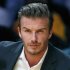 British soccer star David Beckham sits courtside as the Los Angeles Lakers play their season opening game