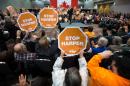 Supporters wave "Stop Harper" signs as NDP leader Thomas Mulcair speaks at a rally in London, Ontario October 4, 2015