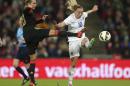 England's Toni Duggan and Germany's Lena Goeduring, left, in action during their International Friendly women's soccer match at Wembley Stadium in London, Sunday Nov. 23, 2014. (AP Photo / Mike Egerton, PA) UNITED KINGDOM OUT - NO SALES - NO ARCHIVES