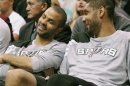 San Antonio Spurs point guard Tony Parker and center Tim Duncan talk on the bench during the second half of their NBA basketball game against the Utah Jazz in Salt Lake City, Utah