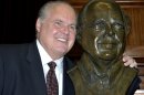 Conservative commentator Rush Limbaugh poses with a bust in his likeness during a secretive ceremony inducting him into the Hall of Famous Missourians on Monday, May 14, 2012, in the state Capitol in Jefferson City, Mo. (AP Photo/Julie Smith)