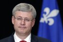 Canada's Prime Minister Harper listens to a question during a news conference at the Hilton hotel in Quebec City