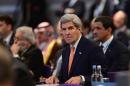 US Secretary of State John Kerry looks on during the 'Supporting Syria and the Region' conference at the Queen Elizabeth II Conference Centre in London, Thursday Feb. 4, 2016. Leaders and diplomats around the world are meeting in London Thursday and pledging some billions of dollars to help millions of Syrian people displaced by war, and try to slow the chaotic exodus of refugees into Europe. (Stefan Rousseau/Pool via AP)