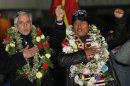 Bolivia's President Evo Morales and Vice President Alvaro Garcia Linera sing the national anthem after Morales' arrival at the El Alto airport on the outskirts of La Paz