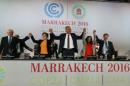 Espinosa, Mezouar and Jagger celebrate after the proclamation of Marrakech, at the UN World Climate Change Conference 2016 (COP22) in Marrakech