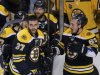 Bruins' Bergeron and Marchand celebrate after the Bruins defeated the Penguins on Bergeron's game-winning goal in double overtime in Game 3 of their NHL Eastern Conference finals hockey playoff series in Boston