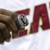 Miami Heat's LeBron James holds his 2012 NBA Finals championship ring during a ceremony before a basketball game against the Boston Celtics, Tuesday, Oct. 30, 2012, in Miami. (AP Photo/J Pat Carter)