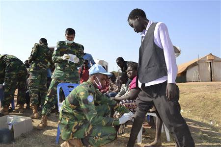Handout photo of medic peacekeepers from UNMISS treating civilians at their compound in the outskirts of Juba