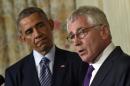 This Nov. 24, 2014, file photo shows President Barack Obama, left, looking to Defense Secretary Chuck Hagel, right, as he talks about his resignation during an event in the State Dining Room of the White House in Washington. The friction between the President and the Pentagon has been particularly pronounced during his six years in office, and seems to be affecting his ability to find a replacement for Defense Secretary Chuck Hagel. Previous Pentagon chiefs have criticized Obama's efforts to micromanage the Pentagon and centralize decision-making in the White House. (AP Photo/Susan Walsh, File)