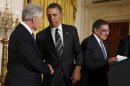 U.S. President Obama greets Defense Secretary-nominee Hagel at the White House in Washington