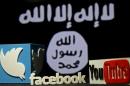 A 3D plastic representation of the Twitter and Youtube logo is seen in front of a displayed ISIS flag in this photo illustration in Zenica, Bosnia and Herzegovina