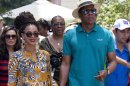 FILE - This April 4, 2013 file photo shows married musicians Beyonce, left, and rapper Jay-Z as they tour Old Havana, Cuba. Jay-Z is addressing his recent trip to Cuba in a new song. The rapper released 