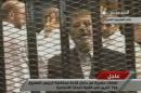 Image grab taken from Egyptian state TV shows ousted Egyptian president Mohamed Morsi in court in Cairo on November 4, 2013