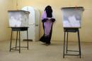 A Sudanese woman prepares to cast her vote at a polling station in Khartoum on April 15, 2015