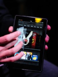 The new Amazon Kindle Fire tablet is seen here at a press conference in New York, in 2011. Kindle Fire proved popular last year, and the small-format Google Nexus 7 joined the Samsung Galaxy in the hot tablet market, dominated by the iPad, which has a screen of nearly 10 inches (24.6 centimeters)