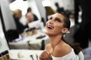 Model Bella Hadid smiles as she has her make-up applied inside Blenheim Palace ahead of a Dior fashion show in Woodstock