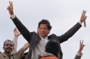 Pakistani cricket legend-turned politician Imran Khan waves to his supporters at a rally in Lahore, Pakistan on Saturday, March 23, 2013. Khan rallied around 100,000 flag-waving supporters in the eastern city of Lahore on Saturday ahead of a historic national election later this spring. (AP Photo/K.M. Chaudary)