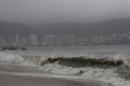 A view of a beach as waves move toward the shore during rainfall brought on by Hurricane Raymond, in Acapulco