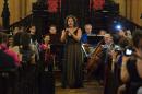Lubana al-Quntar, a Syrian opera singer who was granted asylum in the United States, sings with the Refugee Orchestra Project on World Refugee Day, at the First Unitarian Congregational Society in Brooklyn, New York, on June 20, 2016
