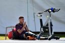 England's midfielder Alex Oxlade-Chamberlain receives treatment to his injured knee during a training session at the Urca military base in Rio de Janeiro on June 9, 2014