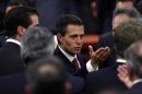 Enrique Pena Nieto gestures after the presentation of the fiscal reform at Los Pinos presidential residence in Mexico City