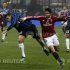 AC Milan's Pato fights for the ball with Inter Milan's Lucio during their Serie A soccer match in Milan