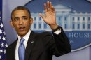 U.S. President Barack Obama waves after speaking at the White House in Washington