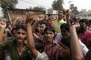 Garment workers chant slogans during a protest against the death of their colleagues in a devastating fire, in Savar