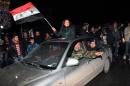 Syrians celebrate on December 22, 2016 in the northern Syrian city of Aleppo, after the army said it has retaken full control of the country's second cityThe army said it has retaken full control of Syria's devastated second city Aleppo