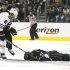 Blackhawks' Keith looks down at Kings' Jeff Carter after Keith hit Carter in the face with his stick in the second period of Game 3 of the NHL Western Conference final hockey playoff in Los Angeles