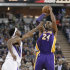 Los Angeles Lakers guard Kobe Bryant, right, shoots over Sacramento Kings forward John Salmons during the first quarter of an NBA basketball game in Sacramento, Calif., Saturday, March 30, 2013. (AP Photo/Rich Pedroncelli)