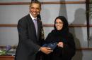 U.S. President Obama presents executive director of Saudi Arabia's National Family Safety Program Al Muneef with U.S. Secretary of State's International Woman of Courage Award in Riyadh