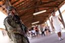 Marines patrol a polling station during municipal elections in Sao Luis