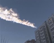 The trail of a falling object is seen above a residential apartment block in the Urals city of Chelyabinsk, in this still image taken from video shot on February 15, 2013. REUTERS/OOO Spetszakaz
