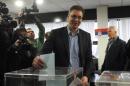 Deputy Prime Minister Aleksandar Vucic and leader of the ruling Serbian Progressive Party (SNS) casts his ballot at polling station in Belgrade on March 16, 2014