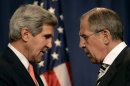 John Kerry (lfet) speaks with Sergei Lavrov in Geneva, on September 14, 2013