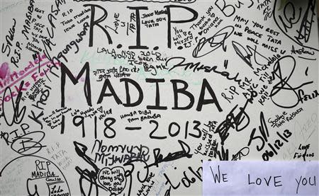 Messages written by mourners are seen outside the residence of former South African President Nelson Mandela in Johannesburg