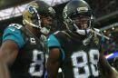 Jacksonville Jaguars wide receiver Allen Hurns (88), right, celebrates after catching the ball for a touchdown during the NFL game between Buffalo Bills and Jacksonville Jaguars at Wembley Stadium in London, Sunday, Oct. 25, 2015. (AP Photo/Tim Ireland)