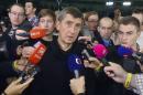 Czech billionaire and the leader of ANO 2011 movement Andrej Babis, center, talks to the reporters after early parliamentary elections finished, in Prague, on Saturday, Oct. 26, 2013. Partial results show the leftist opposition is leading in the vote, which was called to end a political crisis triggered by the center-right government's collapse. With just over 30 percent of all polling stations counted Saturday, the Social Democrats have 22.14 percent of the vote, while the new centrist ANO (YES) movement is second with 18.66 and the Communists are third with 16.95. Prime Minister Petr Necas' center-right coalition broke down in June after a whirlwind of allegations about corruption and marital infidelity. (AP Photo/CTK, Vit Simanek) SLOVAKIA OUT