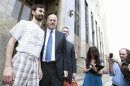Former Goldman Sachs computer programmer Aleynikov smiles as he exits Manhattan Criminal Court with his lawyer Marino in New York