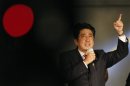 Japan's main opposition Liberal Democratic Party's leader and former Prime Minister Abe delivers a speech atop a campaign van at Akihabara electronics store district in Tokyo