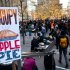 Occupy Wall Street protestors host Thanksgiving dinner in Zuccotti park, Thursday, Nov. 24, 2011, in New York. Protestors used the holiday to give thanks alongside strangers at outdoor Occupy encampments nationwide, serving turkey or donating their time in solidarity with the anti-Wall Street movement. (AP Photo/John Minchillo)
