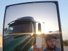 This undated image provided by James Weitze shows a truck driver taking a self portrait on the road. Weitze satisfies his video fix with an iPhone. He sleeps most of the time in his truck, and has no apartment. To be sure, he's an extreme case and probably wouldn't fit into Nielsen's definition of a household in the first place. But he's watching Netflix enough to keep up on shows like “Weeds,” “30 Rock,” “Arrested Development,” “Breaking Bad,” “It's Always Sunny in Philadelphia” and “Sons of Anarchy.” (AP Photo/James Weitze)